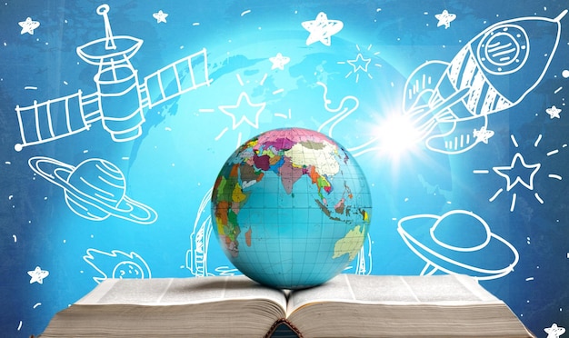 Libro abierto con un globo en el fondo