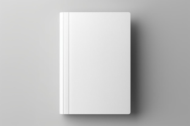 Foto un libro blanco en blanco sobre un fondo gris