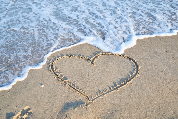 Liebesmitteilung auf den Strandsandferien und -reise