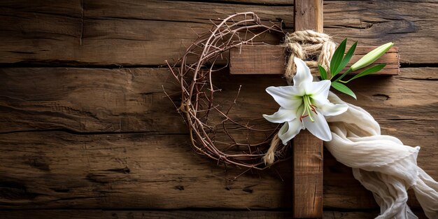 Foto lilienblume und dornenkrone mit holzkreuz