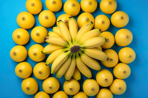 Foto limões amarelos frescos e bananas dispostos em uma forma em fundo ciano