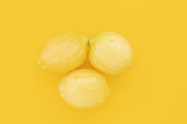 Limones jugosos maduros Limón fruta cítricos concepto mínimo vitamina C Verano creativo minimalista espalda