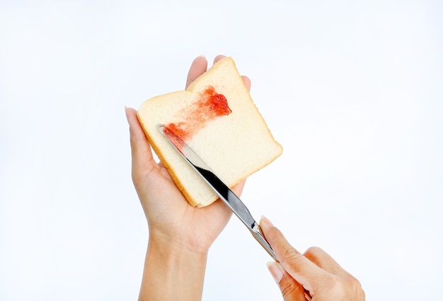Limpe a geléia de morango com pão branco