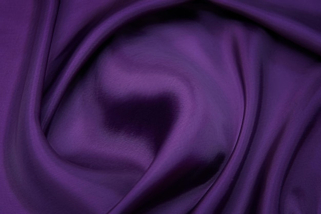 Linda e elegante textura de tecido de luxo de seda violeta ondulada violeta de seda com design de fundo violeta