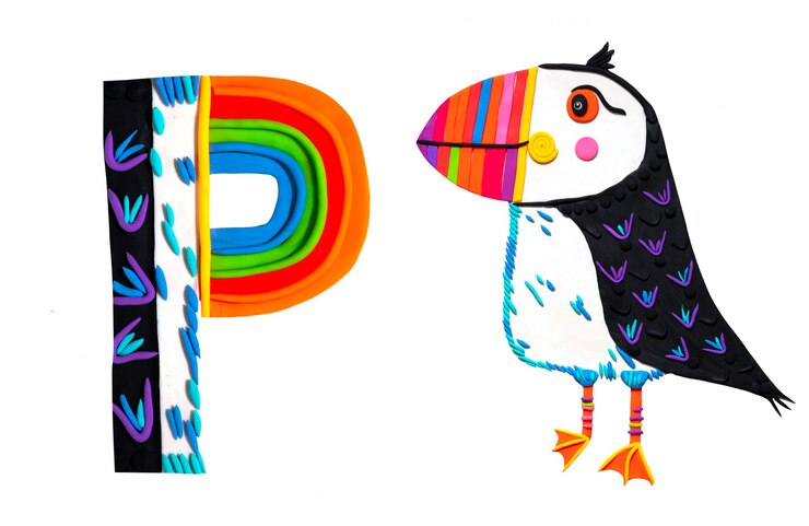Foto lindo pájaro ártico pufi con una letra p alfabeto inglés