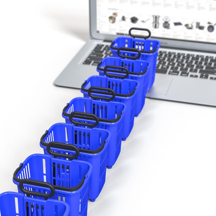 Foto línea de espera, canasta de alimentos carrito de compras en un teclado portátil. concepto de compra en línea.