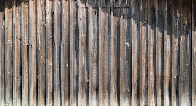 Línea de fondo de madera gris con textura vertical de tablones de madera fachada de valla gris web de encabezado horizontal