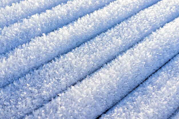 Líneas de diseño de nieve en fondo frío de invierno