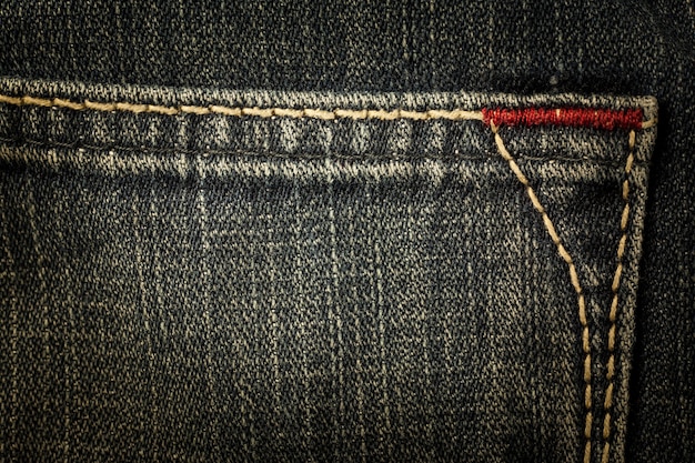 Linha de costura jeans vintage de textura closeup.