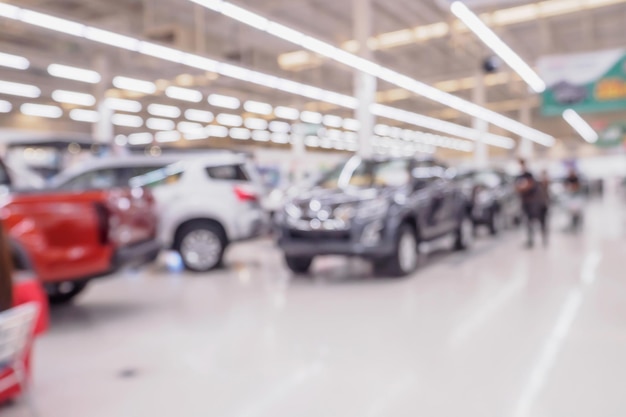 Foto linha desfocada de carro novo na concessionária de showroom de carros abstrato desfocado fundo