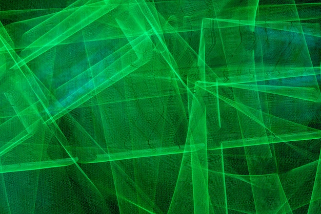 Linhas verdes brilhantes de luzes de néon. fundo abstrato verde.