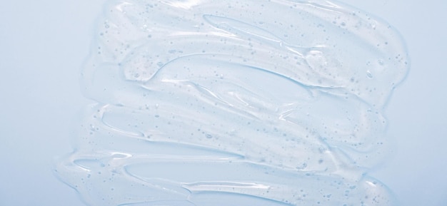 Foto líquido transparente gel suero textura maquillaje y cosméticos textura fondo producto para el cuidado de la piel y formato de banner de crema de belleza