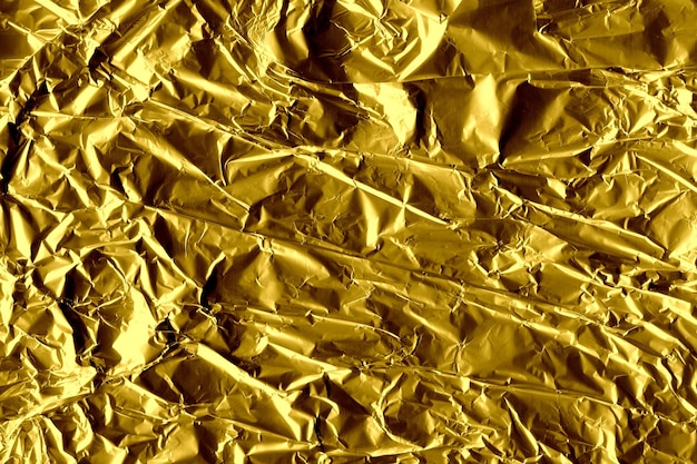 Foto liste mit zerknittertem goldfolienpapierhintergrund
