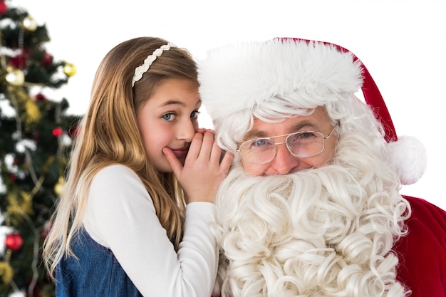 Little girl teling santa claus um segredo