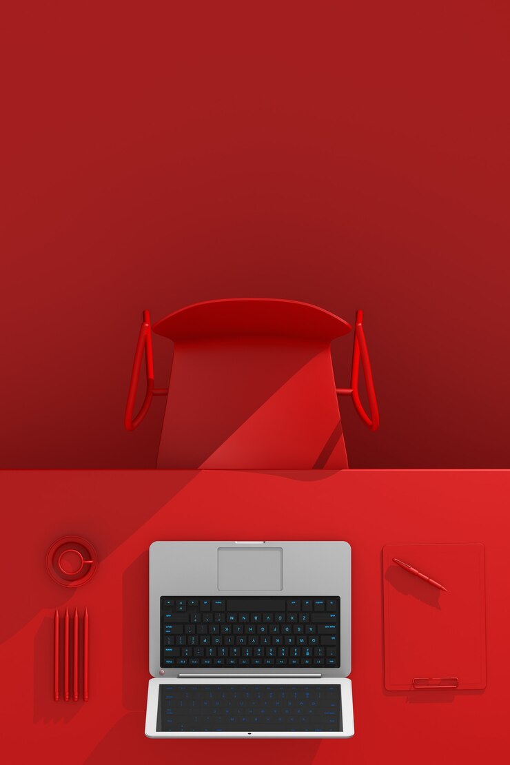 Foto local de trabalho do escritório. mesa com material de escritório, laptop e xícara de café na cor vermelha