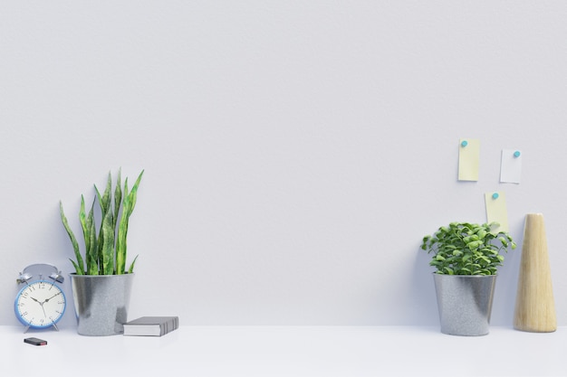 Local de trabalho moderno com mesa criativa com plantas tem parede branca