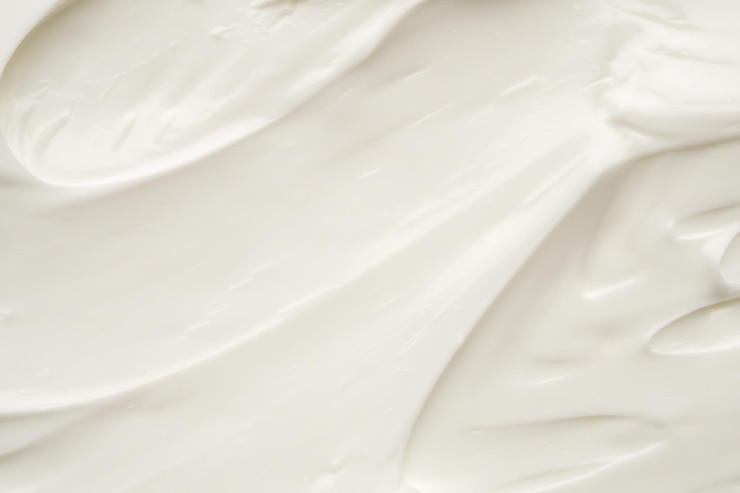 Foto loción blanca para la belleza, crema para el cuidado de la piel, textura, fondo de productos cosméticos