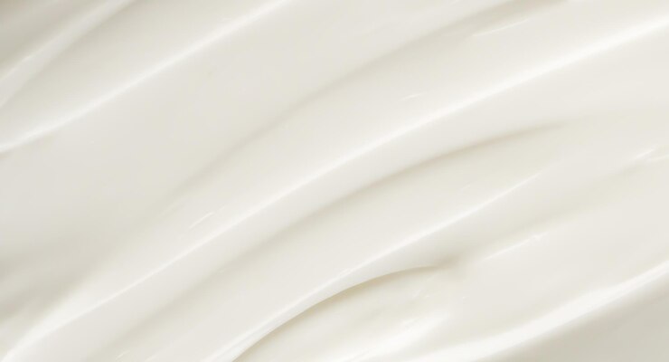 Foto loción blanca para la belleza, crema para el cuidado de la piel, textura, fondo de productos cosméticos