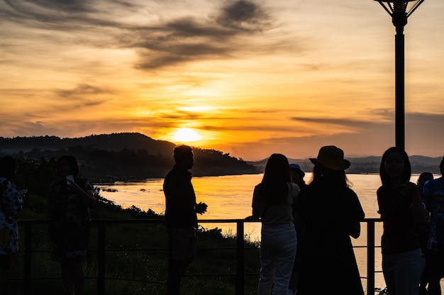 Loei-Thailand-24 out 2020: Silhouette of Unacquainted People with beautiful sunset on maeklong river at chiang khan district loei tailandia.