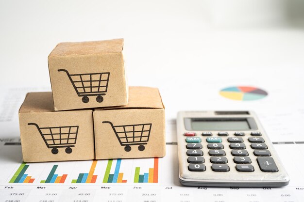 Logotipo del carrito de compras en la caja en el fondo del gráfico Cuenta bancaria Inversión Investigación analítica datos economía comercio Importación de negocios exportación transporte concepto de empresa en línea