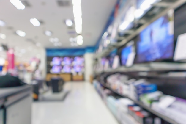 Loja de departamentos eletrônicos mostra televisão, TV e eletrodomésticos com bokeh de fundo desfocado.