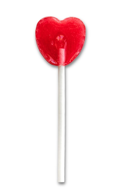 Foto lollipop rojo en forma de corazón aislado sobre un fondo blanco