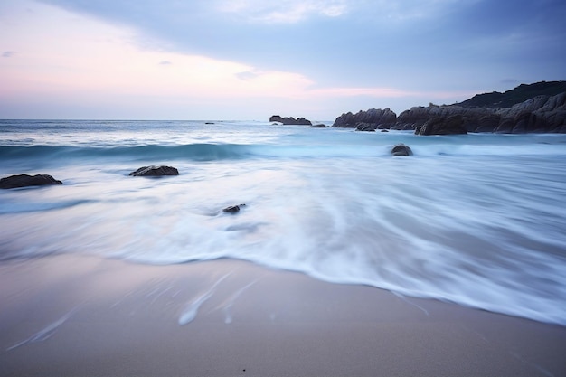 Longa exposição da praia ao pôr do sol Cantábria Espanha