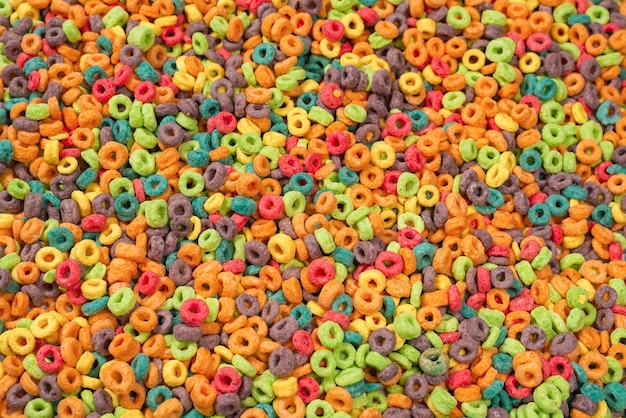 Loops de cereais de flocos multicoloridos doces como pano de fundo