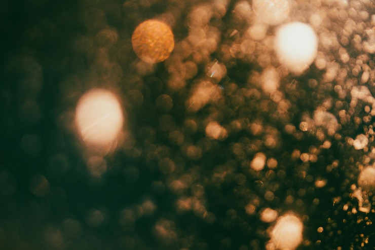 Foto luces de bokeh doradas de fondo de las vacaciones
