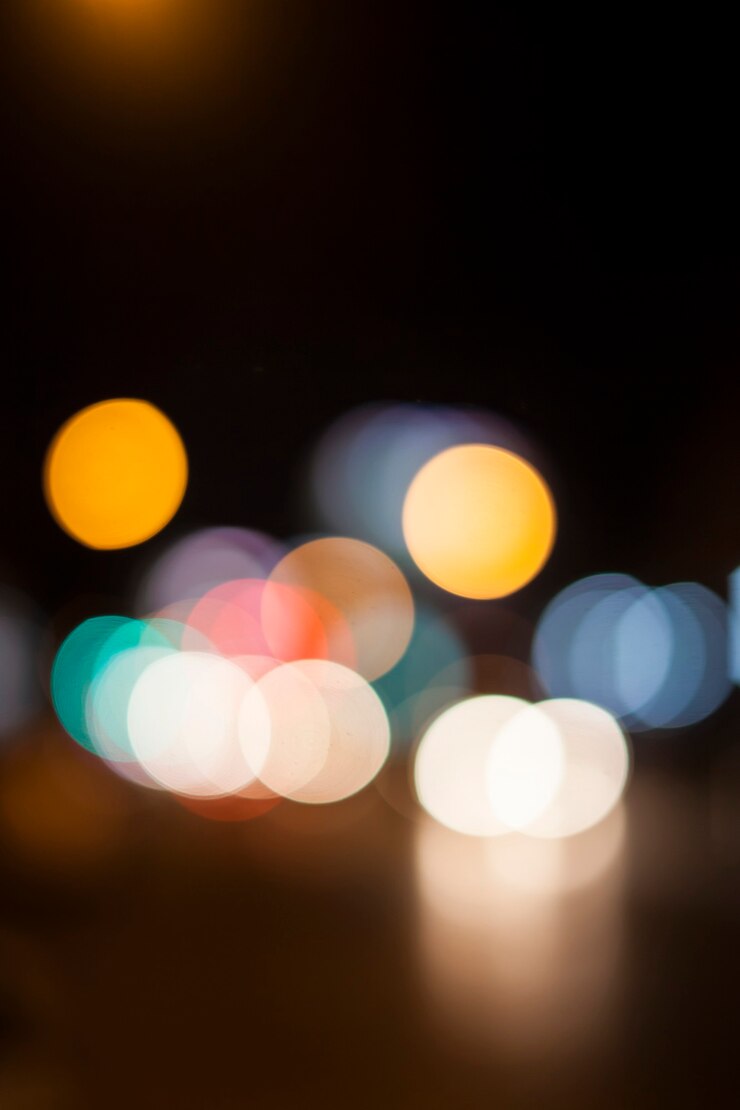 Foto luces de bokeh sobre fondo negro