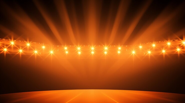 luces brillantes del escenario parpadeando en color naranja para el espacio de copia de tu página