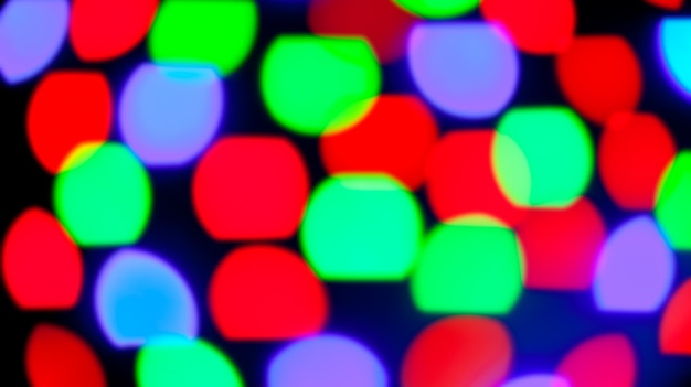 Luces de colores brillantes de bokeh en negro