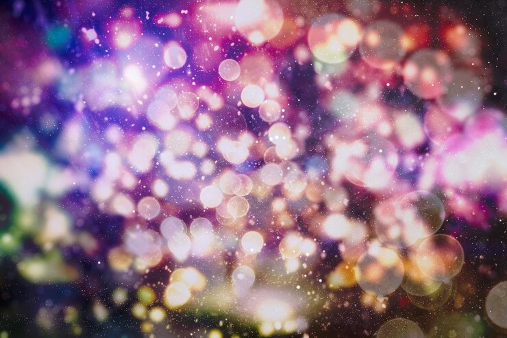Foto luces de navidad. fondo defocused de brillo abstracto de año nuevo de vacaciones de oro con estrellas parpadeantes y chispas.