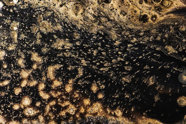 Luxuriöser abstrakter Hintergrund flüssige Kunst Schwarzes Gold Farbmischung Alkohol Tintenkleckse Marmorstruktur Modernes Druckmuster