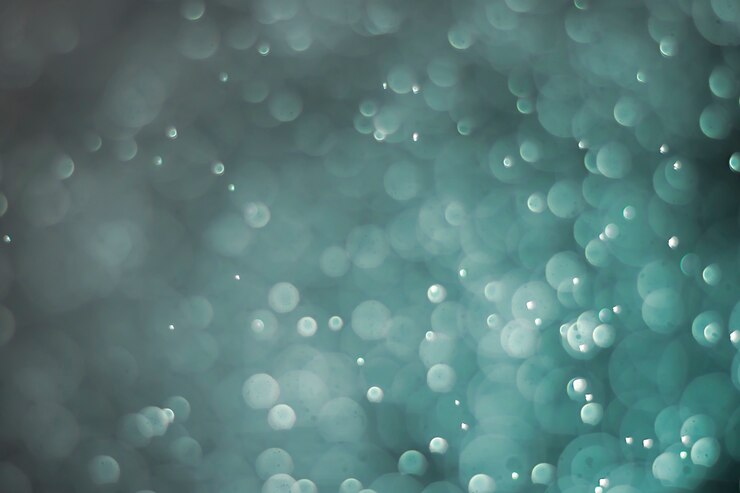 Luz de color de punto de agua bokeh azul para el fondo