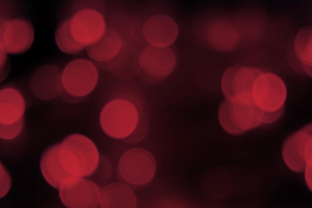 Luzes borradas fundo preto vermelho escuro bokeh abstrato brilhante textura misteriosa festiva
