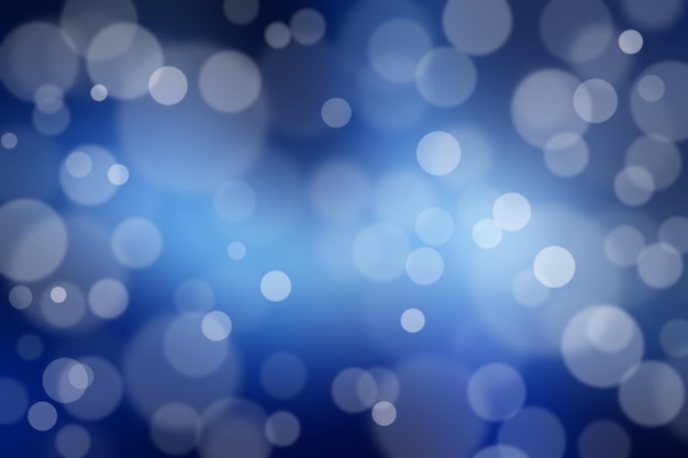 Luzes de bokeh mágicas abstratas. Luzes desfocadas em um fundo azul.