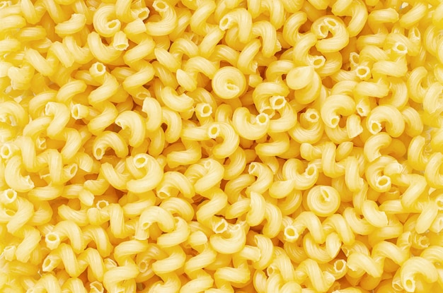 Macarrão cavatappi cru Fundo alimentar Um ingrediente para comida tradicional italiana Closeup