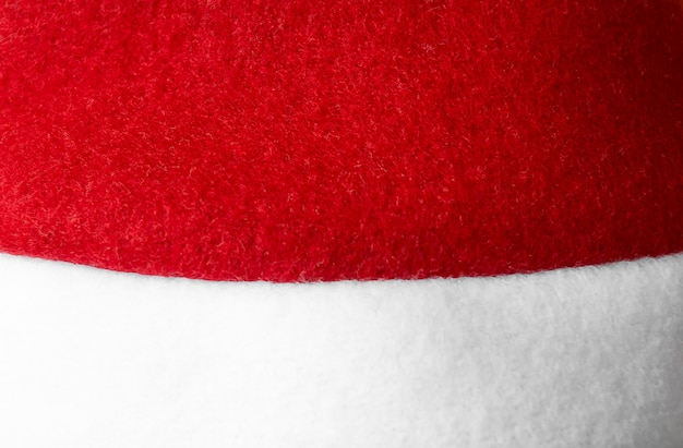 Macro de chapéu vermelho de Papai Noel. textura da tampa.