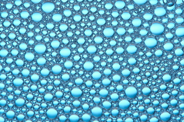 Foto macro fondo azul abstracto con muchas burbujas de jabón