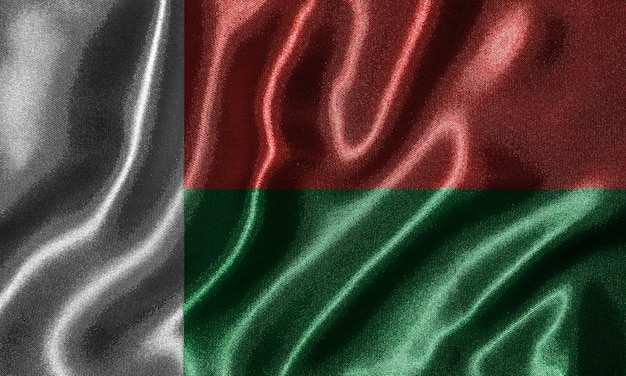 Madagaskar-Flagge - Textilflagge von Madagaskar-Land, Hintergrund der wellenartig bewegenden Flagge.