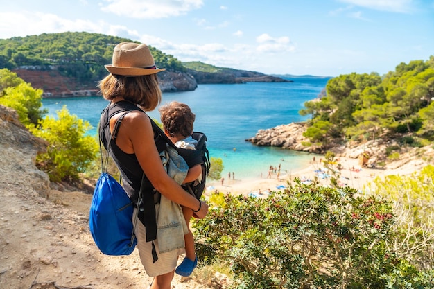 Madre con su hijo en las paradisíacas playas de la costa de Ibiza Playa Salada y Saladeta Balearic