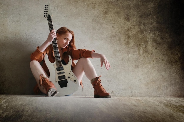 Foto mädchen mit e-gitarren-rock