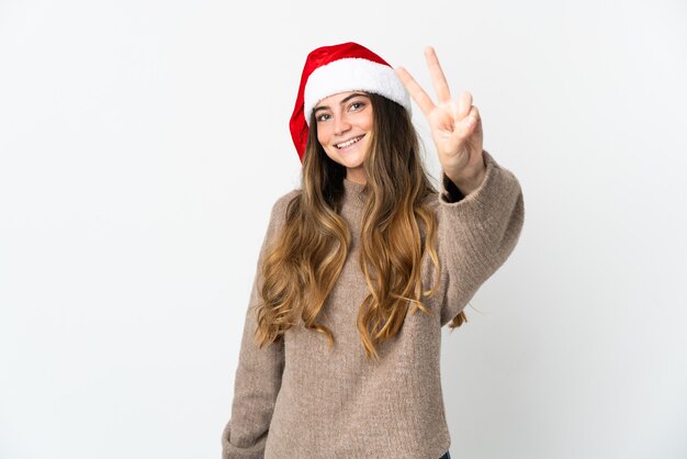 Mädchen mit Weihnachtsmütze lokalisiert auf weißem Hintergrund