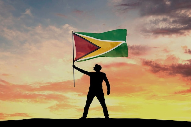 Männliche Silhouettenfigur winkt Guyana-Flagge 3D-Rendering