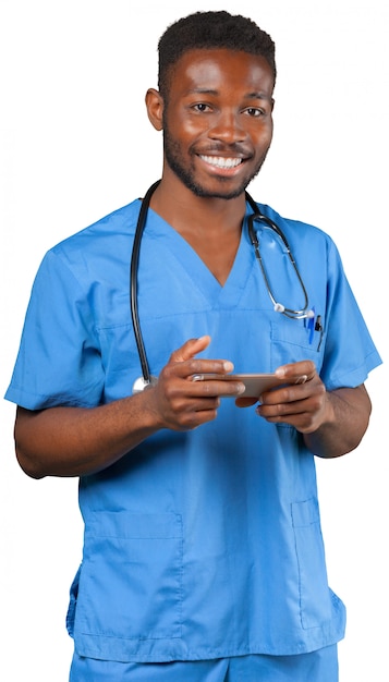 Männlicher Doktor Using Digital Tablet