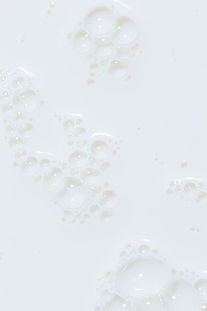 Makro-MilchhintergrundBlasen auf der Milchoberfläche