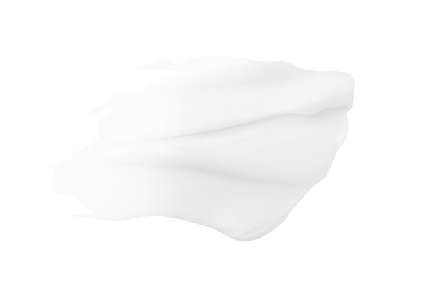 Una mancha de crema blanca sobre un fondo blanco.