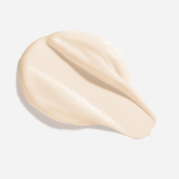 Mancha de frotis de crema de belleza beige Textura de producto cosmético para el cuidado de la piel Muestra de deslizamiento de crema facial