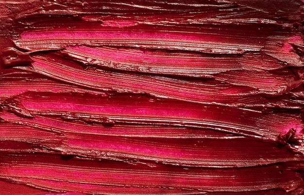 Mancha roja abstracta de lápiz labial brillante Fotografía macro de textura